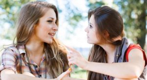 two-young-females-talking-to-each-other